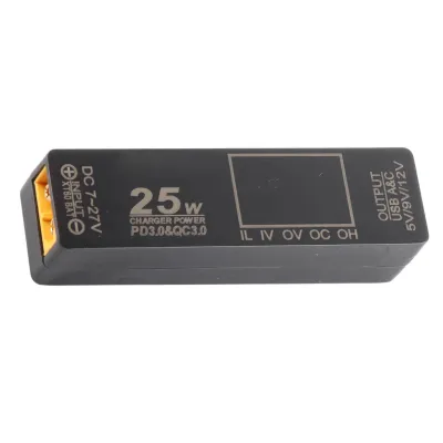 A black electronic device with yellow connectors, displaying text and symbols.