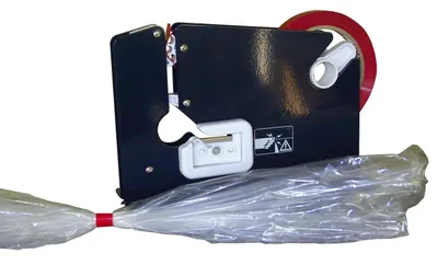 A bag sealer machine with a roll of tape and a sealed plastic bag.