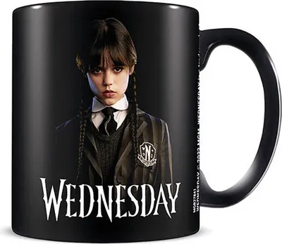 A black mug with the character Wednesday Addams printed on it.