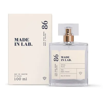 A perfume bottle and its packaging are displayed against a white background.
