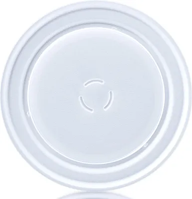 A top-down view of a white glass turntable plate for a microwave.