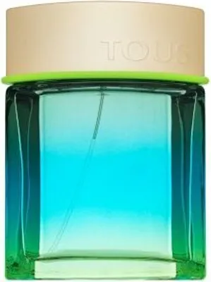 A perfume bottle with a gradient of blue and green, topped with a beige cap.