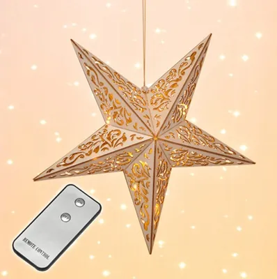 A decorative star-shaped lamp with intricate cutouts and internal lights, shown hanging, with a remote control in the foreground.