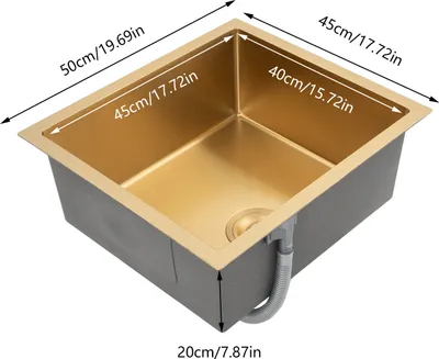 A gold-colored kitchen sink with dimensions labeled.