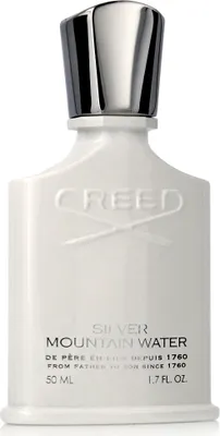 A white bottle of Creed Silver Mountain Water perfume with a silver cap.