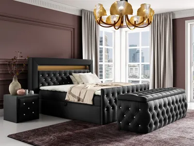 A bedroom scene featuring a black upholstered bed with a tufted headboard and a matching storage bench.