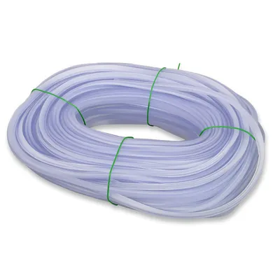 A coil of transparent tubing secured with green ties, against a white background.