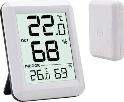 A digital thermometer and hygrometer with a separate outdoor sensor, displayed on a white background.