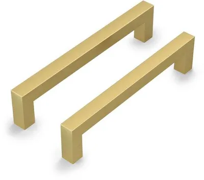 Obrázok produktu pre Uniqoos® Sada 2 kusov nerezových úchytiek na nábytok, zlatá povrchová úprava, rozmer otvorov 128 mm, nerezová oceľ, hranatý, minimalistický dizajn vhodný pre kuchynské skrinky a komody