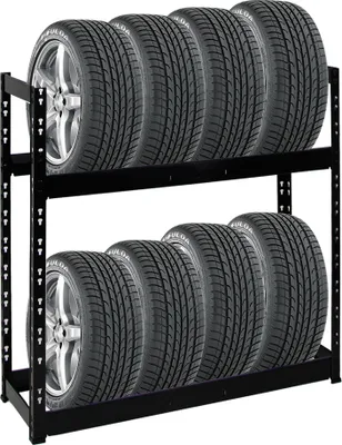 A black metal tire rack holding two rows of tires against a white background.