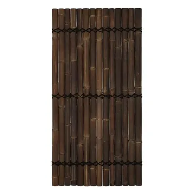 A panel of dark brown bamboo poles tied together with black string.