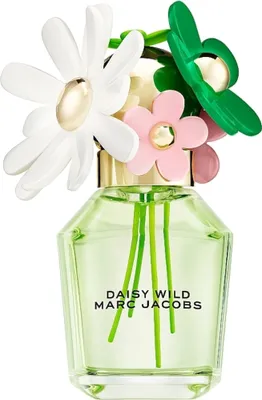 A perfume bottle with decorative flowers on top.