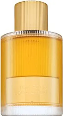 A close-up studio shot of a Tom Ford perfume bottle.