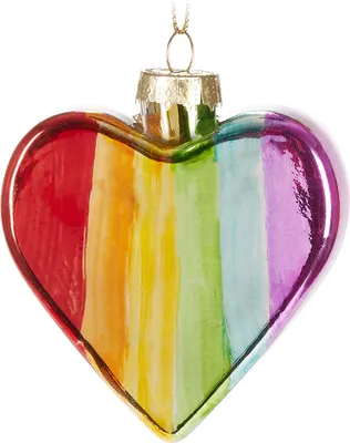 A heart-shaped glass ornament with rainbow stripes, hanging from a gold loop.