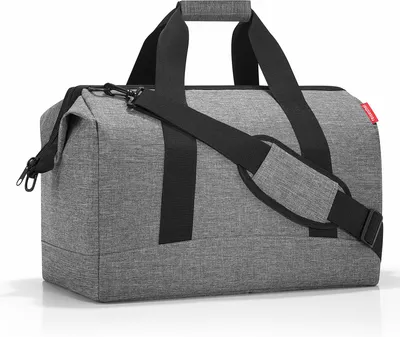A gray duffel bag with black straps and a black shoulder strap, shown against a white background.