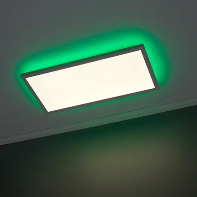 A rectangular LED panel light with green ambient lighting mounted on a ceiling.