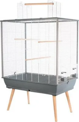 A bird cage on a stand, isolated on a white background.