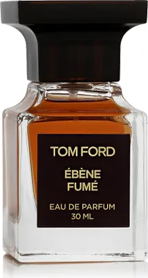 A close-up studio shot of a Tom Ford perfume bottle.