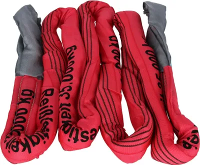 A pile of red lifting slings with black text and gray ends.