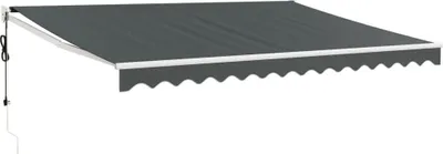 A dark gray retractable awning with a white trim and scalloped edge is shown extended against a white background. A black cord hangs from the left side of the awning mechanism.