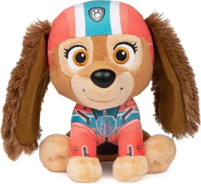 A plush toy dog wearing a helmet and uniform.