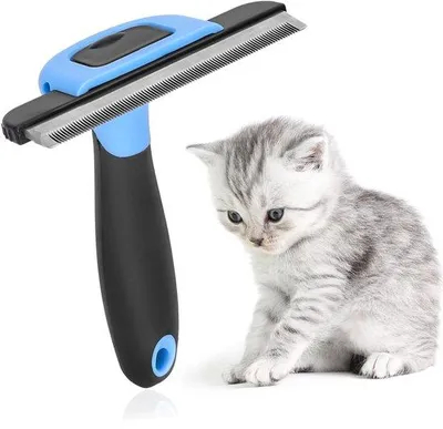 Imagen del producto de Ibenzoa®: Cepillo multifuncional para el cuidado del pelaje de perros y gatos. Incluye un peine de acero inoxidable de 13,5 x 7 cm, autolimpiable, resistente al agua y a la corrosión. Elimina la capa inferior del pelaje y el pelo suelto