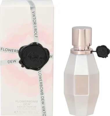 A perfume box and bottle are displayed side-by-side against a white background.