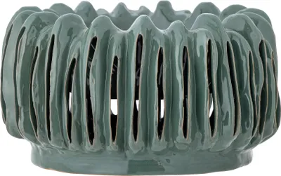 A close-up studio shot of a green ceramic pot.