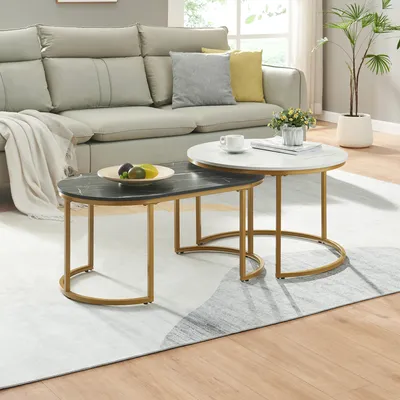 A living room setting with a sofa and nesting coffee tables.