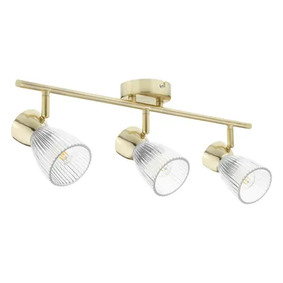 A three-light ceiling spotlight fixture with adjustable heads, featuring a gold-finished metal bar and base, and clear ribbed glass shades.