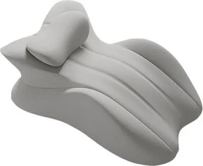 A light gray, ergonomically shaped pillow designed for couples' intimacy, presented on a white background.