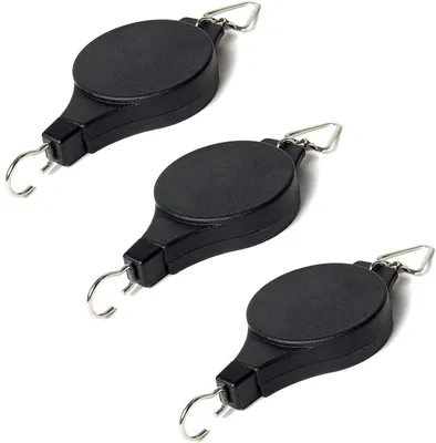 Three black retractable pulley hooks are arranged diagonally on a white background.