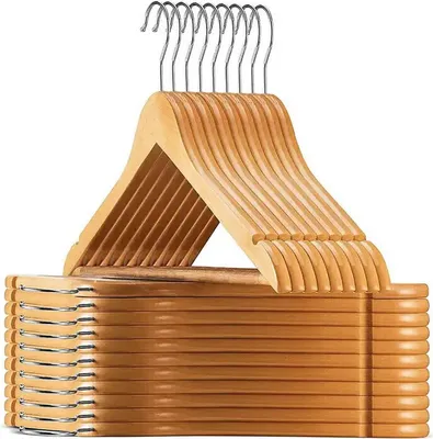 A stack of wooden hangers with metal hooks, presented against a white background.