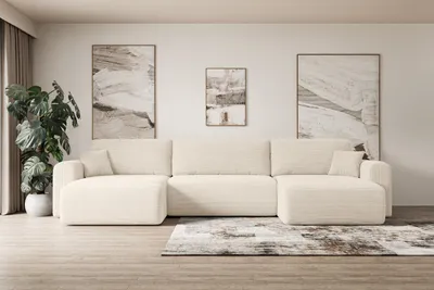 A modern living room with a large U-shaped sofa, abstract art on the wall, and a potted plant.