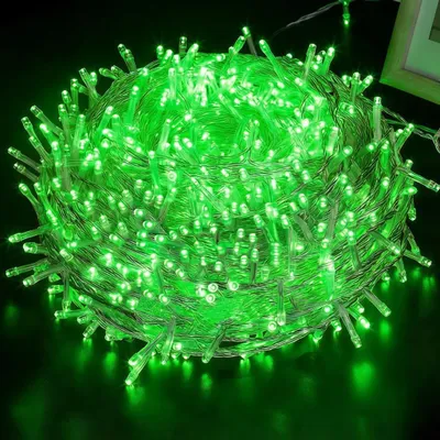 A tightly wound ball of green LED string lights.