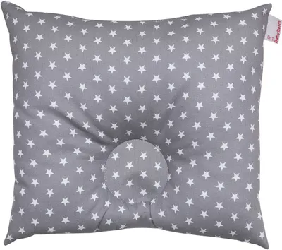 A close-up, straight-on studio shot of a gray pillow with white stars, featuring a circular indentation in the center.