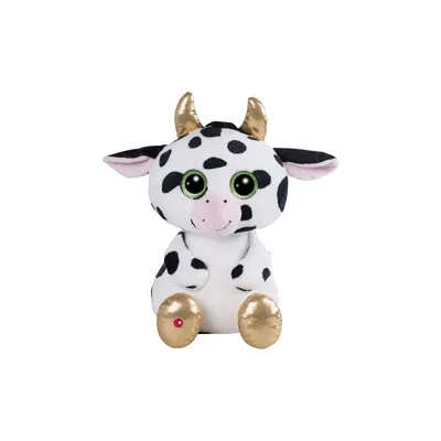 A plush toy cow with black spots, large green eyes, and gold accents on its horns and feet, sitting against a white background.