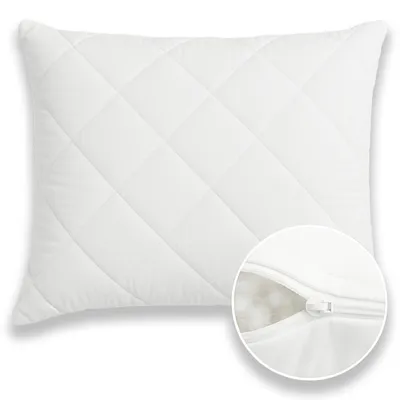 A white quilted pillow with a close-up view of a zipper revealing the filling.