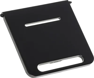 A black metal part with slots, likely a component of a larger appliance.