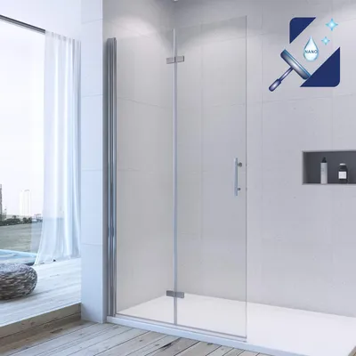 A modern bathroom with a glass shower enclosure.
