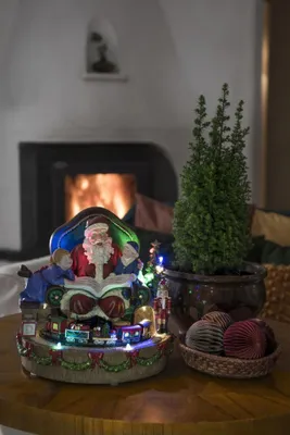Produktbild von Konstsmide LED Szenerie Weihnachtsmann mit Kindern und Zug, wählbare Energiefunktion und 8 klassischen Weihnachtsliedern, 12 bunte Dioden, 4.5V Innentrafo/batteriebetrieben, Innen - 4215-000