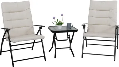 Two beige upholstered folding chairs and a small black folding table with a glass top, set against a white background.