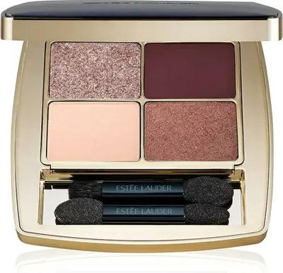 An open Estée Lauder eyeshadow palette with four shades and two applicators.