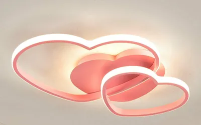 A pink heart-shaped ceiling light fixture with integrated LED lighting.