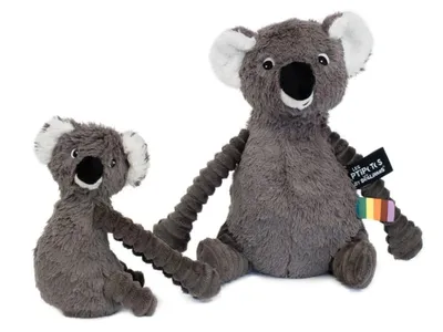 Two plush koalas, a larger one and a smaller one, are sitting side-by-side against a white background.