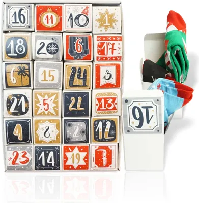 A box of advent calendar cubes with socks spilling out of a separate box.