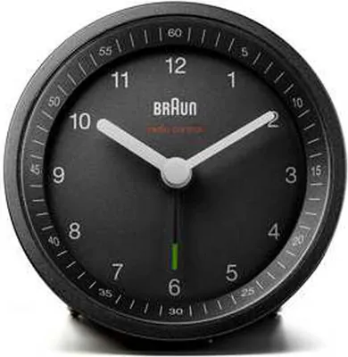 A close-up studio shot of a black Braun alarm clock.