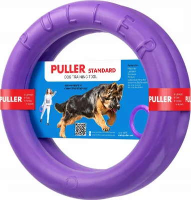A purple dog toy ring with packaging and a German Shepherd dog.