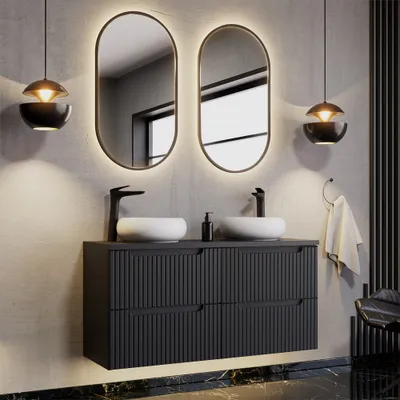 A modern bathroom vanity with two sinks, mirrors, and pendant lights.