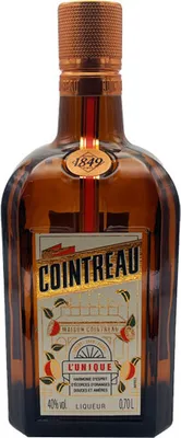 A bottle of Cointreau liqueur on a white background.